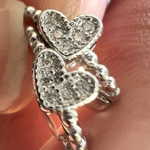 Item 1 - Sterling silver heart shaped hoop earrings with cubic zirconia inset